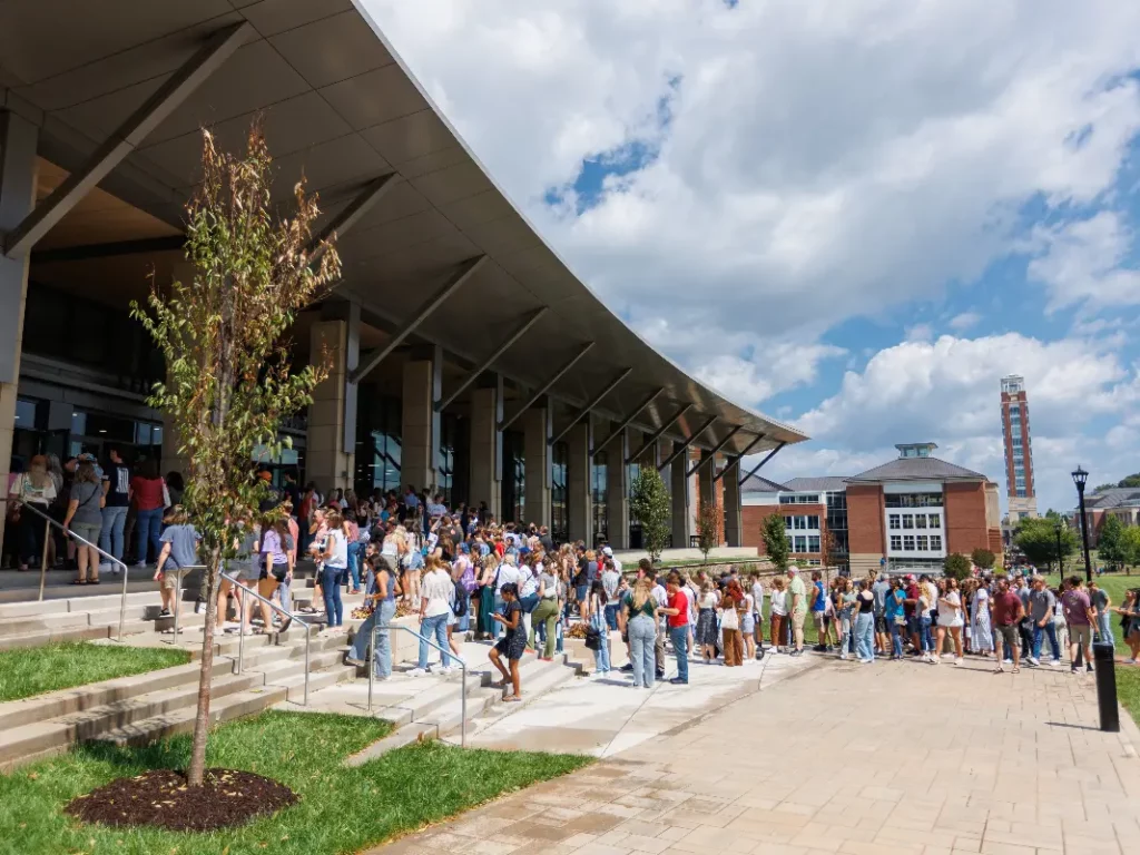 A dining commons does far more than feed students. It shapes daily behavior, establishes routine, and plays a central role in fostering belonging and well-being. When thoughtfully designed and carefully stewarded, it becomes a campus’s most powerful day-to-day social engine. At Liberty University, the 3,000-seat Reber-Thomas Dining Commons now serves that role. More than the largest next-generation residential dining facility in North America, it functions as the daily center of gravity for campus life. It is a place where students gather, linger, connect, and return, reinforcing community, continuity, student retention, and persistence through everyday experience.